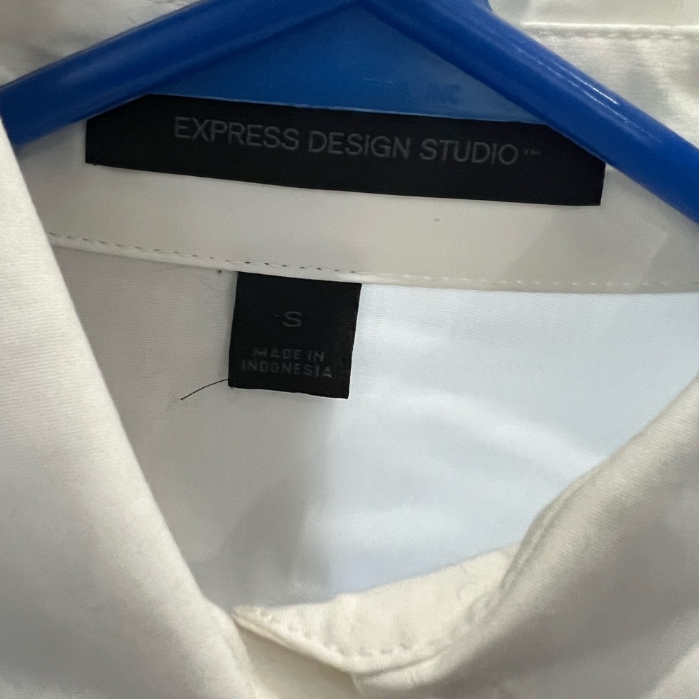Express women’s white button up dress shirt with diamond embellishment.
